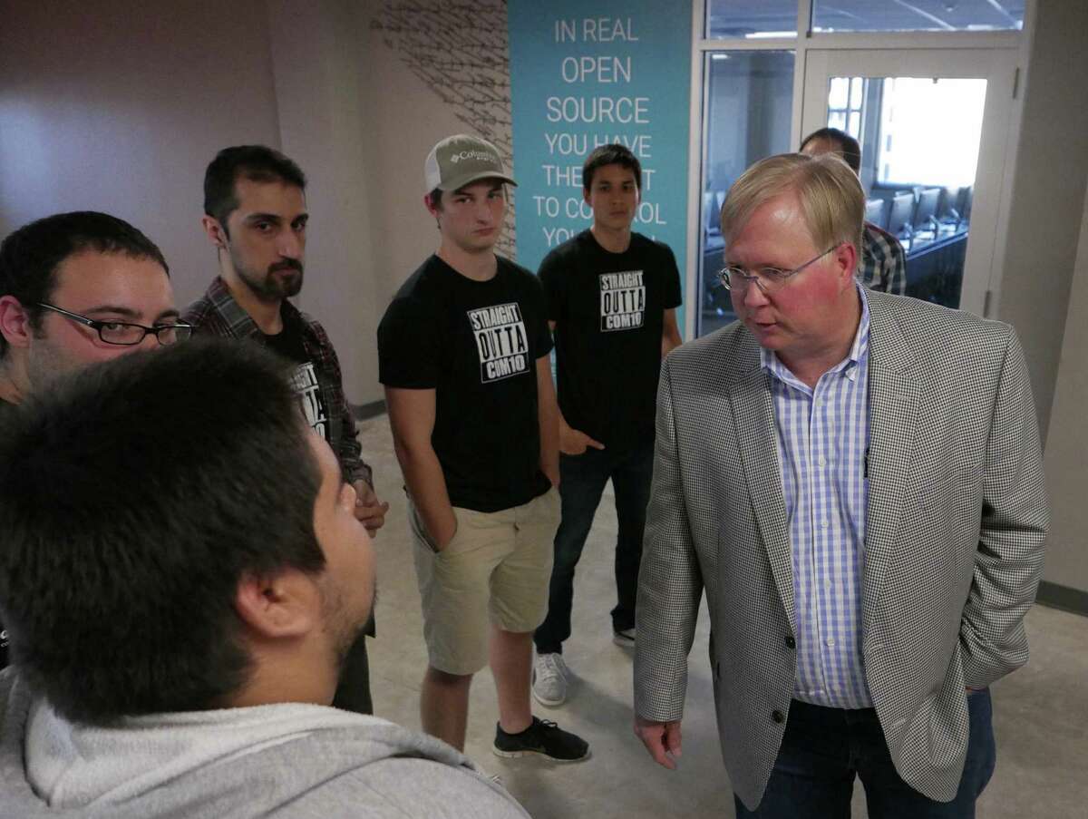 Graham Weston, co-founder and Chairman of Rackspace, speaks with students and staff in November. His nearly 19 million shares could be cashed out for more than half a billion dollars if the company sells.