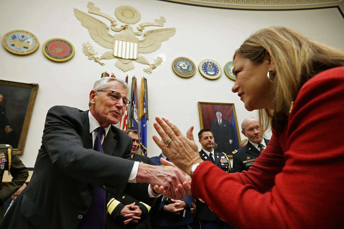 WASHINGTON, DC - NOVEMBER 13: U.S. Defense Secretary Chuck Hagel (L) is greeted by House Armed Services Committee member Rep. Loretta Sanchez (R-CA) before a committee hearing about the ongoing fight against the group calling itself the Islamic State (ISIL) in the Rayburn House Office Building November 13, 2014 in Washington, DC. The United States military continues to bomb ISIL targets in both Iraq and Syria and plans to double the number of American troops in Iraq to 3,000. (Photo by Chip Somodevilla/Getty Images)