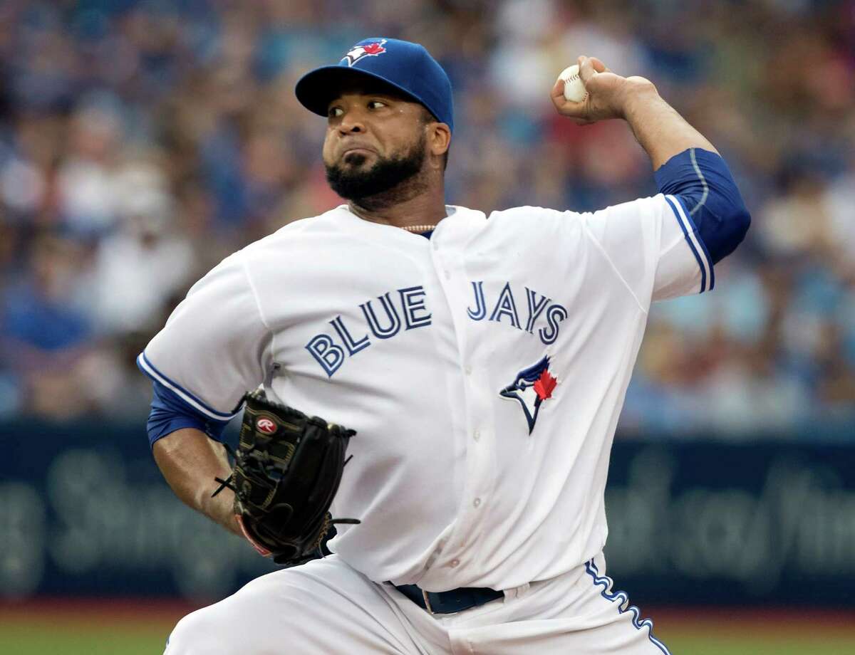 Toronto Blue Jays starting pitcher Francisco Liriano throws against the Houston Astros during the first inning of a baseball game in Toronto, Friday, Aug. 12, 2016. (Fred Thornhill/The Canadian Press via AP)