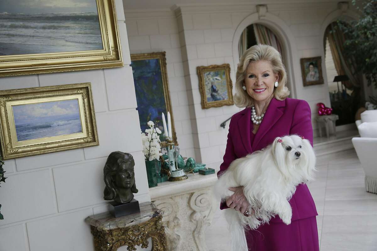 Dede Wilsey poses for a portrait with her dog Dazzle at her home on Tuesday, September 22, 2015 in San Francisco, Calif.