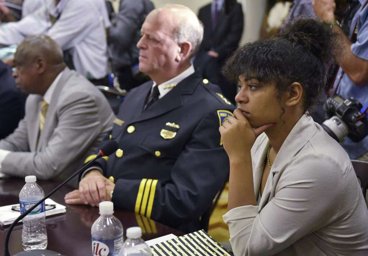 Black Lives Matter activist Mica Grimm, right, listens beside New Haven Police Chief Dean Esserman during a discussion on community policing and criminal justice on July 13, in Washington, D.C.