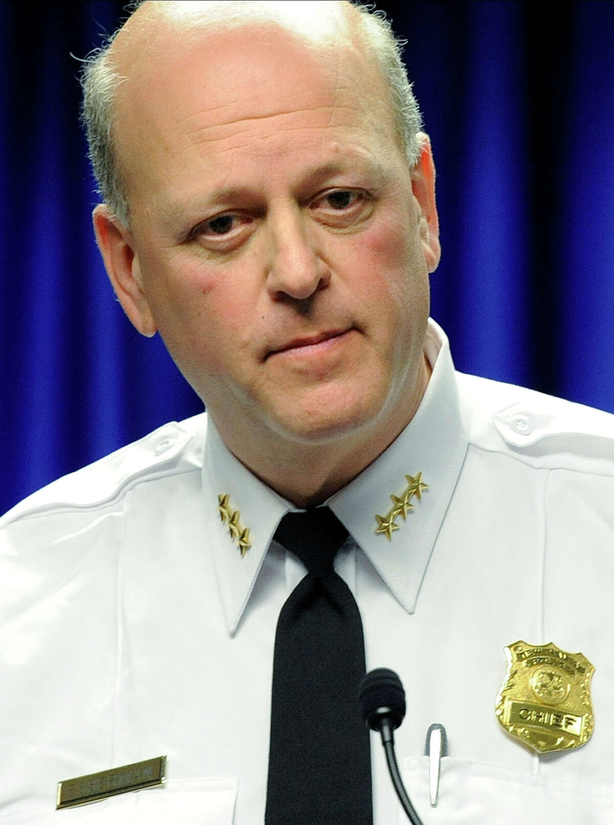 New Haven Police Chief Dean Esserman speaks at 2012 news conference about a new effort to reduce gun violence. Esserman is on a three-week paid leave of absence for allegedly berating a waitress in July.