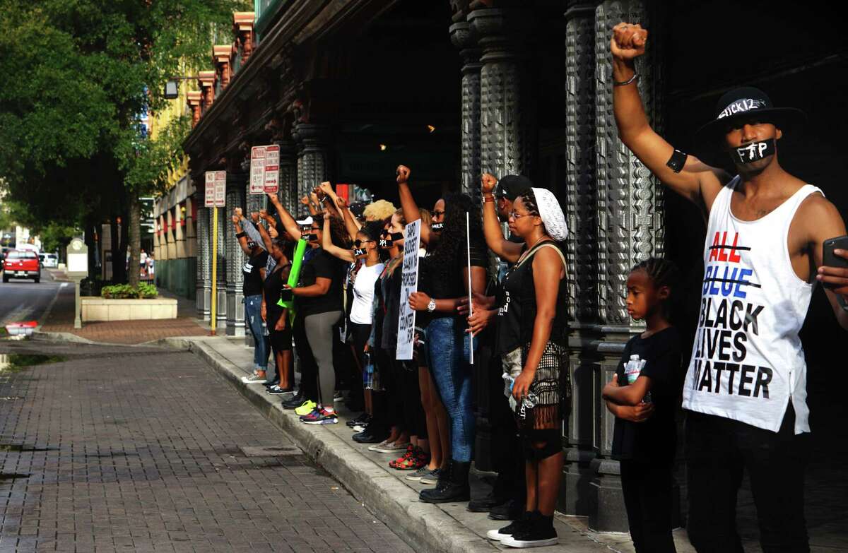 Black Lives Matter protest draws attention to police contract