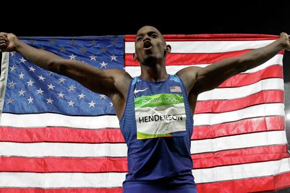 Jeff Henderson celebrates his dramatic achievement Saturday. His sixth and final jump proved to be the winner for the American, whose 27-6 leap outdistanced his foes and captured the gold medal in the long jump in Rio de Janeiro.﻿