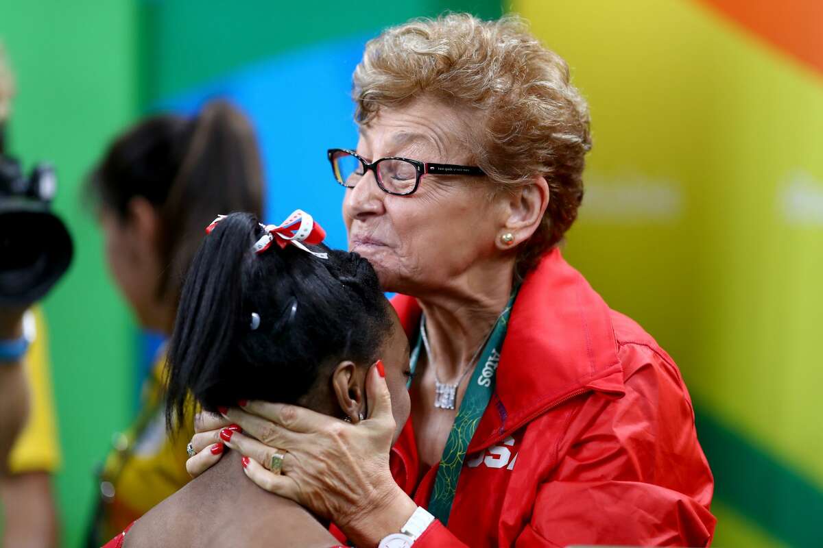 RIO DE JANEIRO, BRAZIL - AUGUST 14: Simone Biles of the United States is congratulated by team coordinator Marta Karolyi after winning the gold medal in the Women's Vault on Day 9 of the Rio 2016 Olympic Games at the Rio Olympic Arena on August 14, 2016 in Rio de Janeiro, Brazil. (Photo by Ryan Pierse/Getty Images)