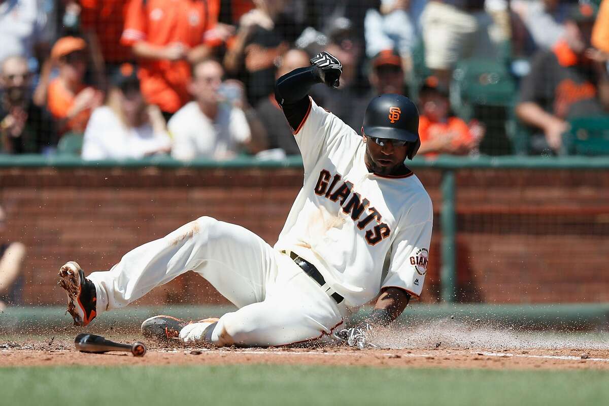SAN FRANCISCO, CA - AUGUST 14: Eduardo Nunez #10 of the San Francisco Giants crosses home plate to score on a single hit by Trevor Brown #14 of the San Francisco Giants in the second inning against the Baltimore Orioles during an interleague game at AT&T Park on August 14, 2016 in San Francisco, California. (Photo by Lachlan Cunningham/Getty Images)