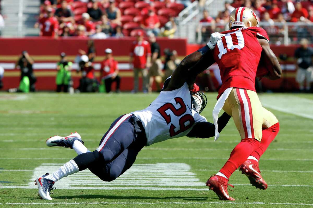Andre Hal (29) attempts to bring down receiver Bruce Ellington (10) during a preseason game between the 49ers and the Houston Texans at Levi's Stadium in Santa Clara, California, on Sunday, August 14, 2016.