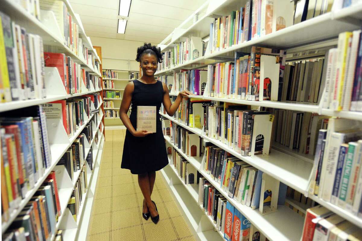 Mareesca Gordon, a recent Stamford High School graduate, poses for a photo inside the main branch of the Ferguson Library on Thursday, August 4, 2016. Gordon is urging the district to adopt textbooks that portray African Americans in positive ways.