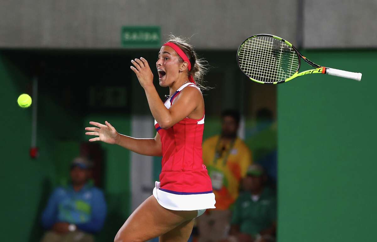Monica Puig of Puerto Rico reacts after defeating Angelique Kerber of Germany in the Women's Singles Gold Medal Match on Day 8 of the Rio 2016 Olympic Games at the Olympic Tennis Centre on August 13, 2016 in Rio de Janeiro, Brazil. Puig defeated Kerber 6-4, 4-6, 6-1. (Photo by Clive Brunskill/Getty Images)