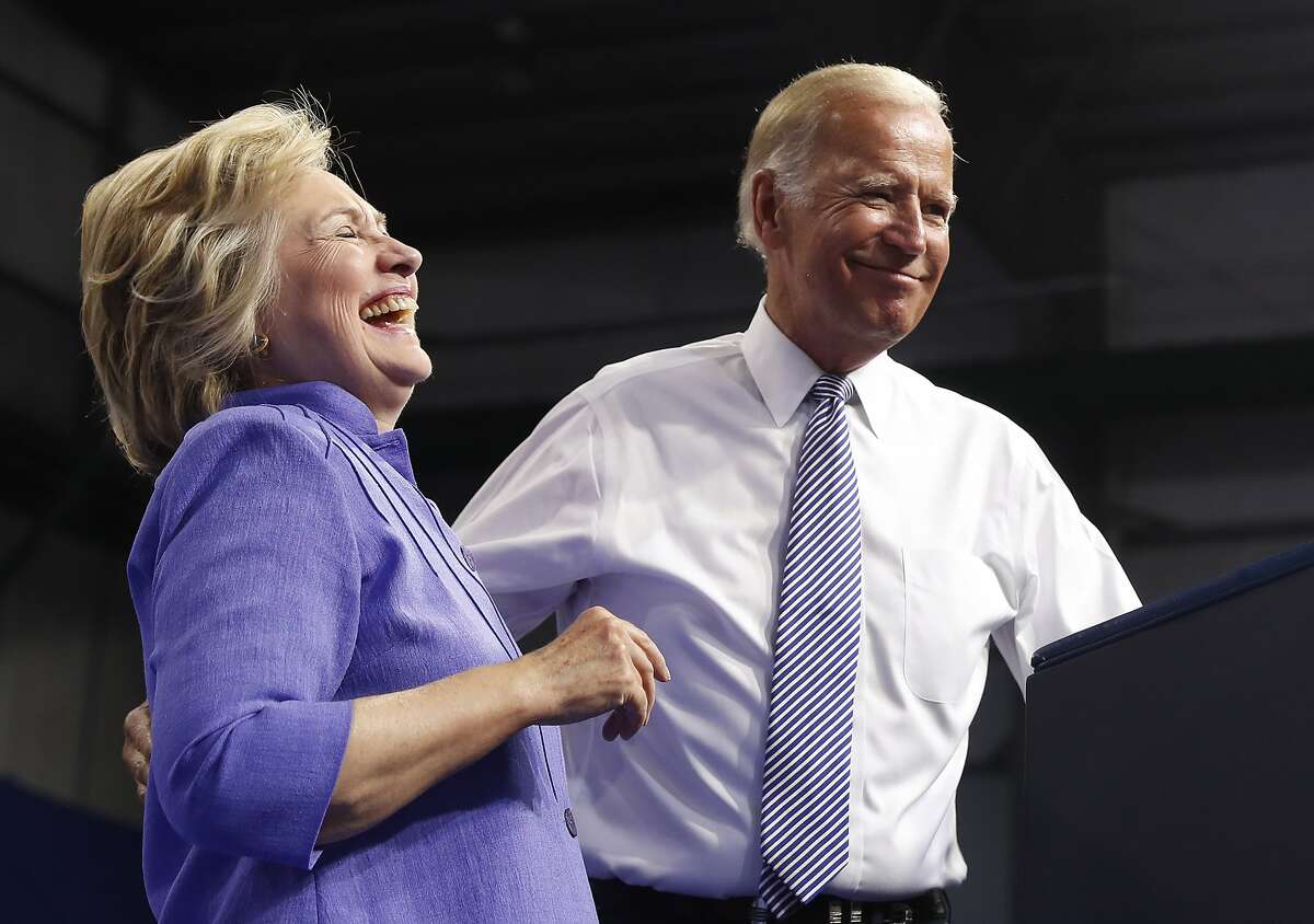 Democratic presidential candidate Hillary Clinton and Vice President Joe Biden stand together on stage during a campaign event at Riverfront Sports in Scranton, Pa., Monday, Aug. 15, 2016. (AP Photo/Carolyn Kaster)