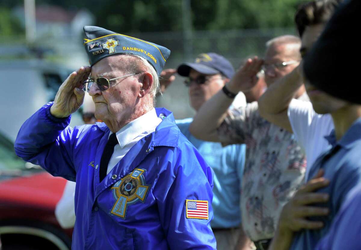 John Edmond, left, 90, of Danbury, who served on the U.S. Providence during World War II, participates in a ceremony at the Rogers Park Rose Garden marking the 71 st anniversary of the Japanese surrender and the end of World War II, Monday, August 15, 2016 in Danbury.