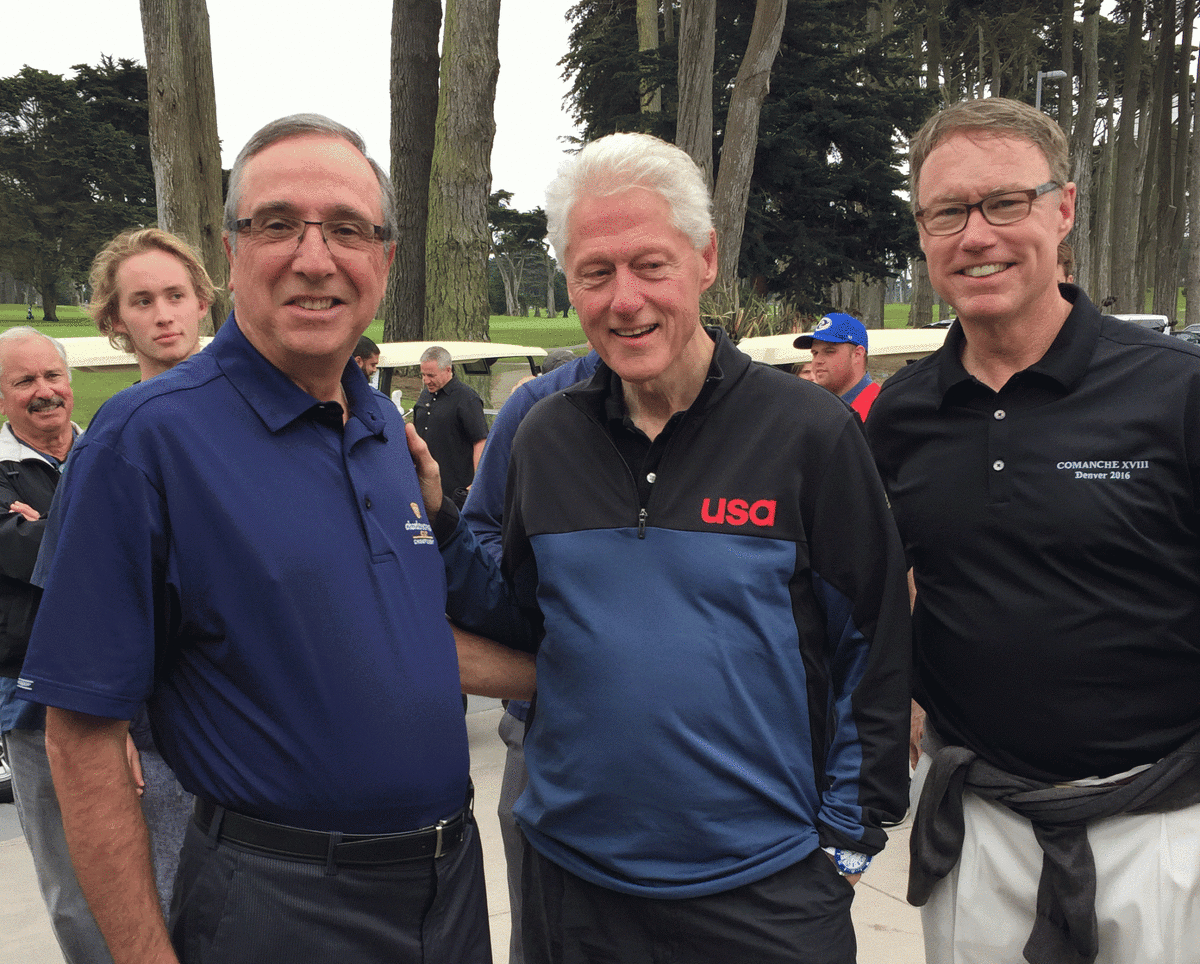 Mike Ippolito (left) and Todd McKenna (right) pose with former president Bill Clinton at TPC Harding Park in San Francisco on August 14th, 2016. 