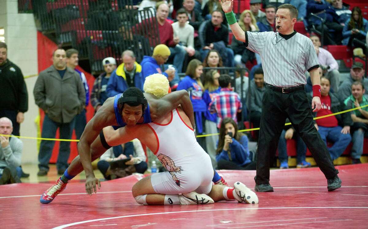 Xavier Bass of Harding, left, won a state title at 195 pounds last season.