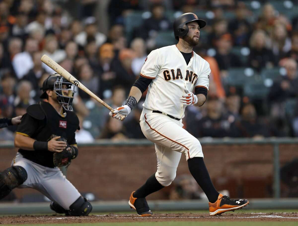 San Francisco Giants' Brandon Belt swings for a base hit off Pittsburgh Pirates pitcher Ryan Vogelsong in the first inning of a baseball game Aug. 15 in San Francisco.