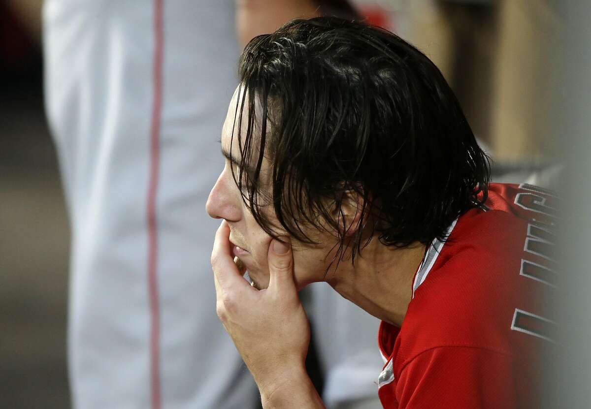 Los Angeles Angels starting pitcher Tim Lincecum sits in the dugout during a baseball game against the Seattle Mariners, Friday, Aug. 5, 2016, in Seattle. (AP Photo/Ted S. Warren)
