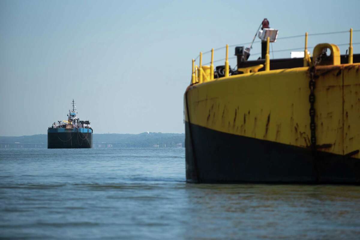 A barge and tugboat anchored along the Hudson River near Yonkers, N.Y., Aug. 4, 2016. Officials and many residents say a plan from the maritime industry to create 10 anchorage sites on the river would be a step backward for communities that have worked hard to shed their industrial pasts. Under the proposal, Yonkers and two villages to the north, Hastings-on-Hudson and Dobbs Ferry, would have by far the most barges at anchor, with 16 berths spread across 715 acres on the water. (Karsten Moran/The New York Times) ORG XMIT: XNYT85