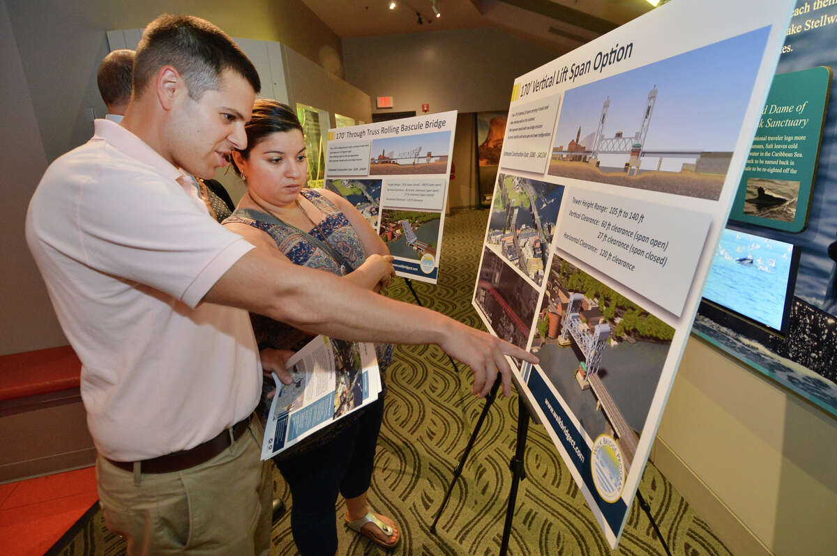 Rob Sachnin and wife Sharen Trepovich-Sachnin look at the vertical span options for the ConnDOT Walk Bridge project during an informational meeting for residents at The Maritime Aquarium in Norwalk Conn. on Tuesday August 16, 2016