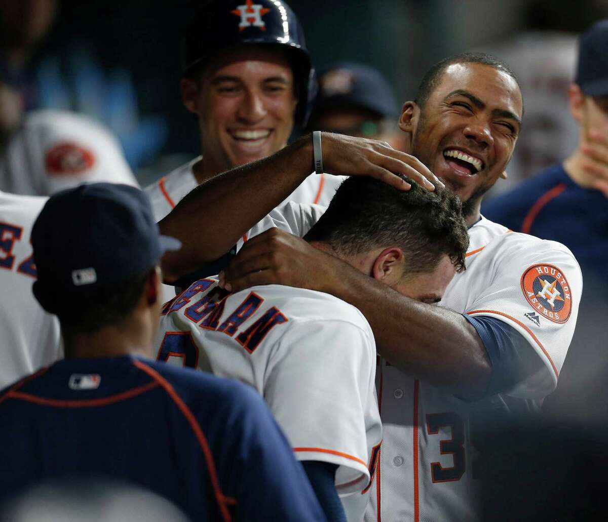 Houston Astros third baseman Alex Bregman (2) celebrates with Teoscar Hernandez (35) after hitting his first major league home run during the first inning of an MLB game at Minute Maid Park,Tuesday, Aug. 16, 2016, in Houston.