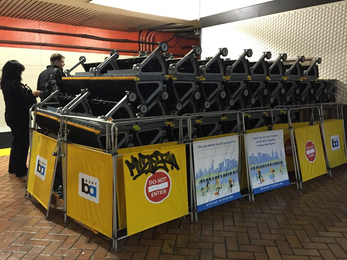 A stack of escalator parts being stored at the end of the Powell St. BART platform.