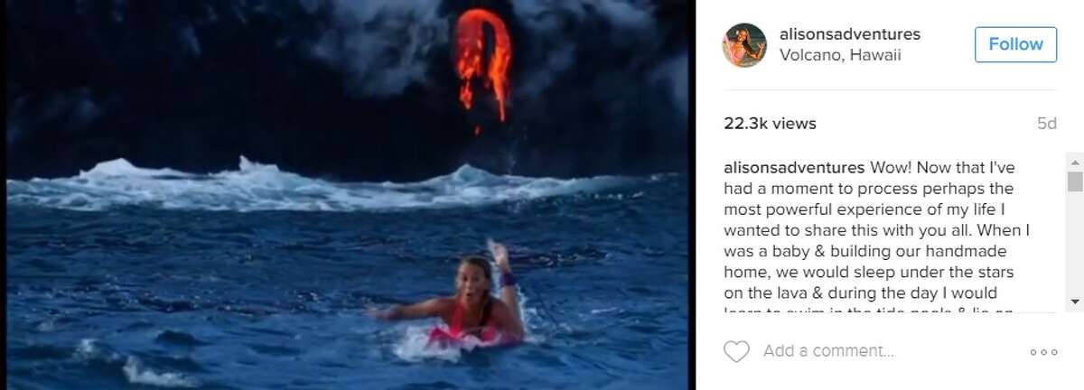 Alison Teal, filmmaker, swam in the water in Hawaii as a volcano erupted behind her on Aug. 10, 2016.