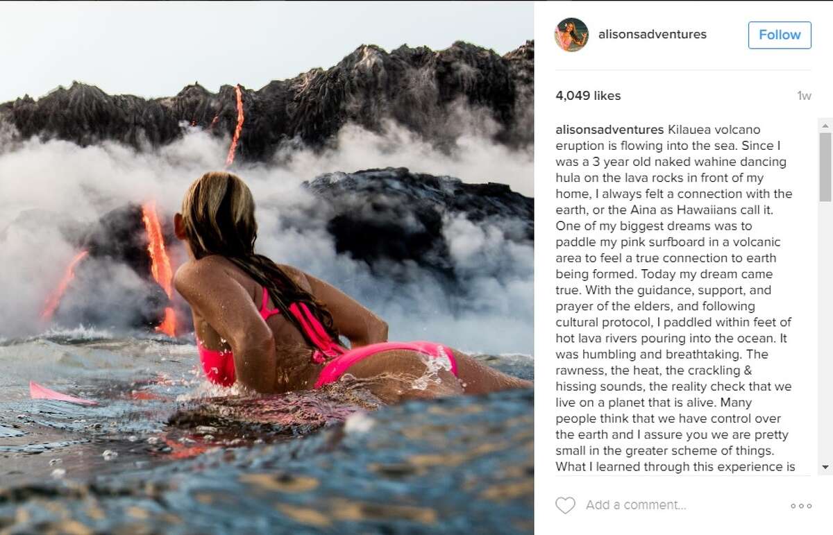 Alison Teal, filmmaker, swam in the water in Hawaii as a volcano erupted behind her on Aug. 10, 2016.