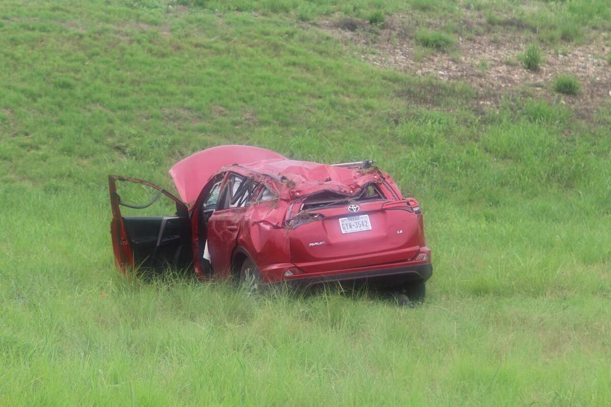 A woman rolled her car off the highway after an accident on Wurzbach Parkway near Wetmore Road Aug. 17, 2016.