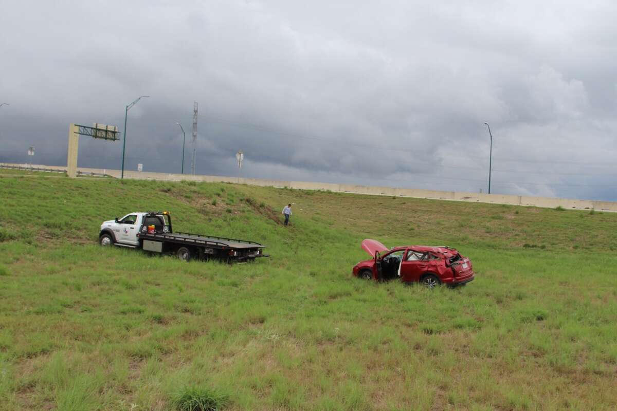 A woman rolled her car off the highway after an accident on Wurzbach Parkway near Wetmore Road Aug. 17, 2016.