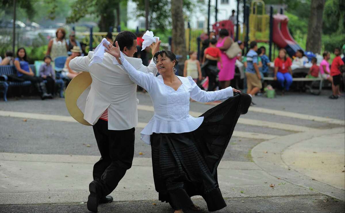 Victor Trejo and Marlube Huamani, both of Stamford perform a Paruvian dance called " Marinera Nortena " for residents attending the Family Friendship Festival Latino Night at Carwin Park in Stamford, Conn. on Tuesday, Aug. 16, 2016. Trejo and Huamani both immigrated from Peru with there families and became friends. The festival was the last of several Tuesday night concerts held by the Take Back Carwin Park Committee, in hopes of bringing the Westside community together.