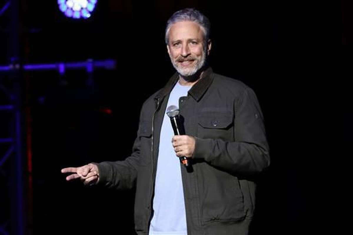 In this Tuesday, Nov. 10, 2015, file photo, comedian Jon Stewart performs at the 9th Annual Stand Up For Heroes event, in New York. Stewart delivered a riff reminiscent of his "Daily Show" days during an appearance on CBS' "Late Show with Stephen Colbert" on July 21, 2016. (Photo by Greg Allen/Invision/AP)