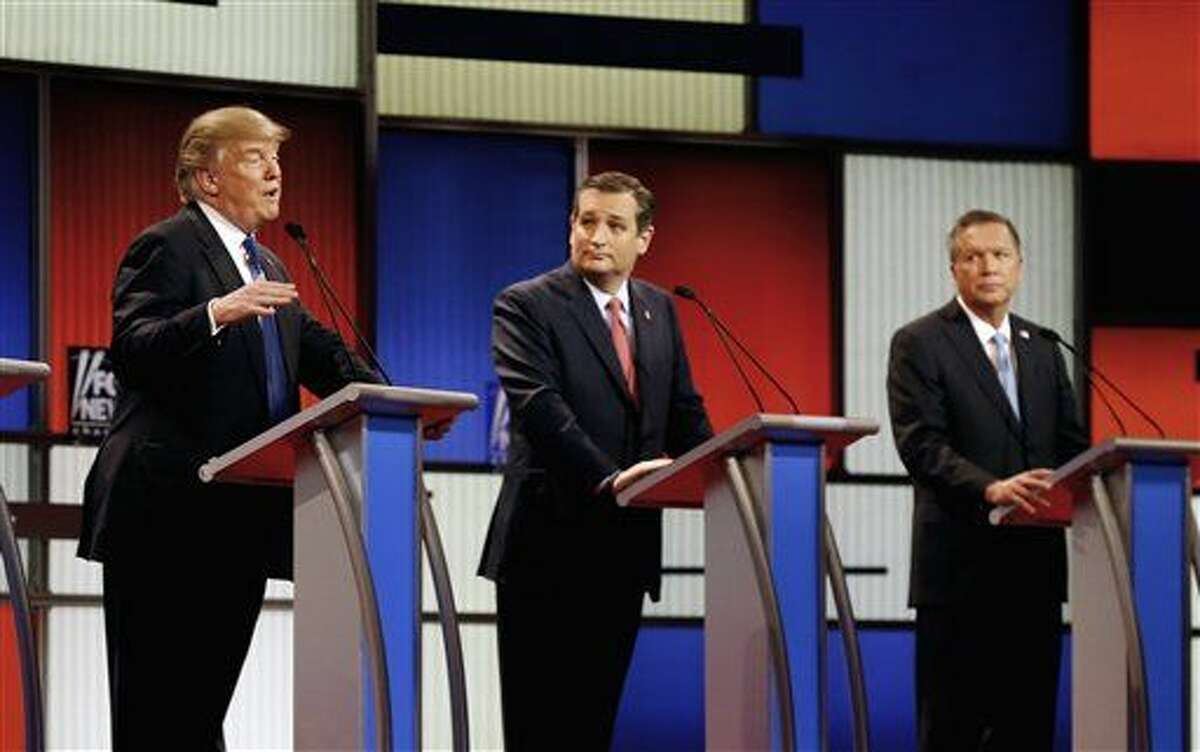 In this March 3, 2016 file photo, Republican presidential candidates, businessman Donald Trump, Sen. Ted Cruz, R-Texas, and Ohio Gov. John Kasich appear during a Republican presidential primary debate at the Fox Theatre in Detroit. Michigan Republicans meet Saturday, April 9, in Lansing for their annual convention with one of the main agenda items the choosing of delegates to the party’s presidential convention in July in Cleveland. (AP Photo/Paul Sancya)