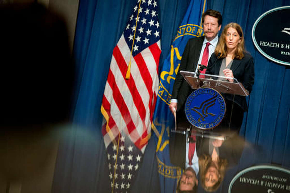 Department of Health and Human Services Secretary Sylvia Burwell, right, accompanied by Food and Drug Administration Commissioner Dr. Robert Califf, left, speaks at a news conference at the Hubert H. Humphrey Building in Washington, Thursday, May 5, 2016, to announce new regulation extending the FDA's authority to all tobacco products including e-cigarettes. (AP Photo/Andrew Harnik)