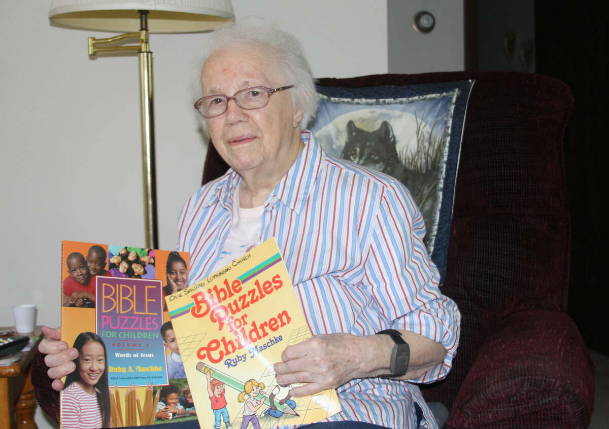 Ruby Maschke, 93, of Bad Axe holds some of the books she has written.