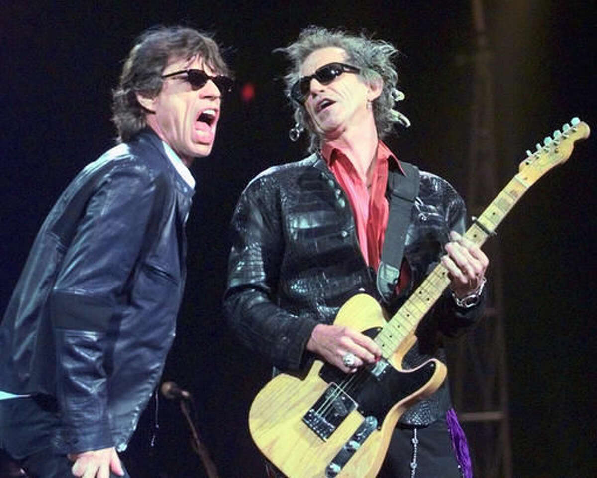 In this Monday, March 22, 1999, file photo, Mick Jagger, left, and Keith Richards perform "Jumping Jack Flash" during the Rolling Stones' No Security Tour performance at the Fleet Center in Boston. Goldenvoice Entertainment, a subsidiary of AEG Live, announced Tuesday, May 3, 2016, that Paul McCartney, The Rolling Stones, Roger Waters, Neil Young, The Who and Bob Dylan will perform for Desert Trip, during a three-day concert, Oct. 7-9, 2016, at the desert grounds where the annual Coachella Valley Music and Arts festival is held in Indio, Calif. (AP Photo/Elise Amendola)
