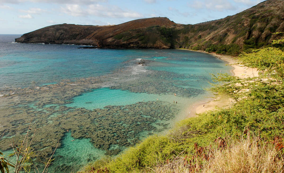 Oahu’s Hanauma Bay on Wednesday, May 6, 2016 near Honolulu. Much of the inner reef at Hanauma Bay is dead after decades of tourist interaction, but the outter reef is still relatively healthy. More than 2,000 international reef scientists, policymakers and stakeholders are gathering in Hawaii starting Monday, June 20, 2016, to discuss the latest coral science and what can be done to stop widespread death of the world's reefs.(AP Photo/Caleb Jones)