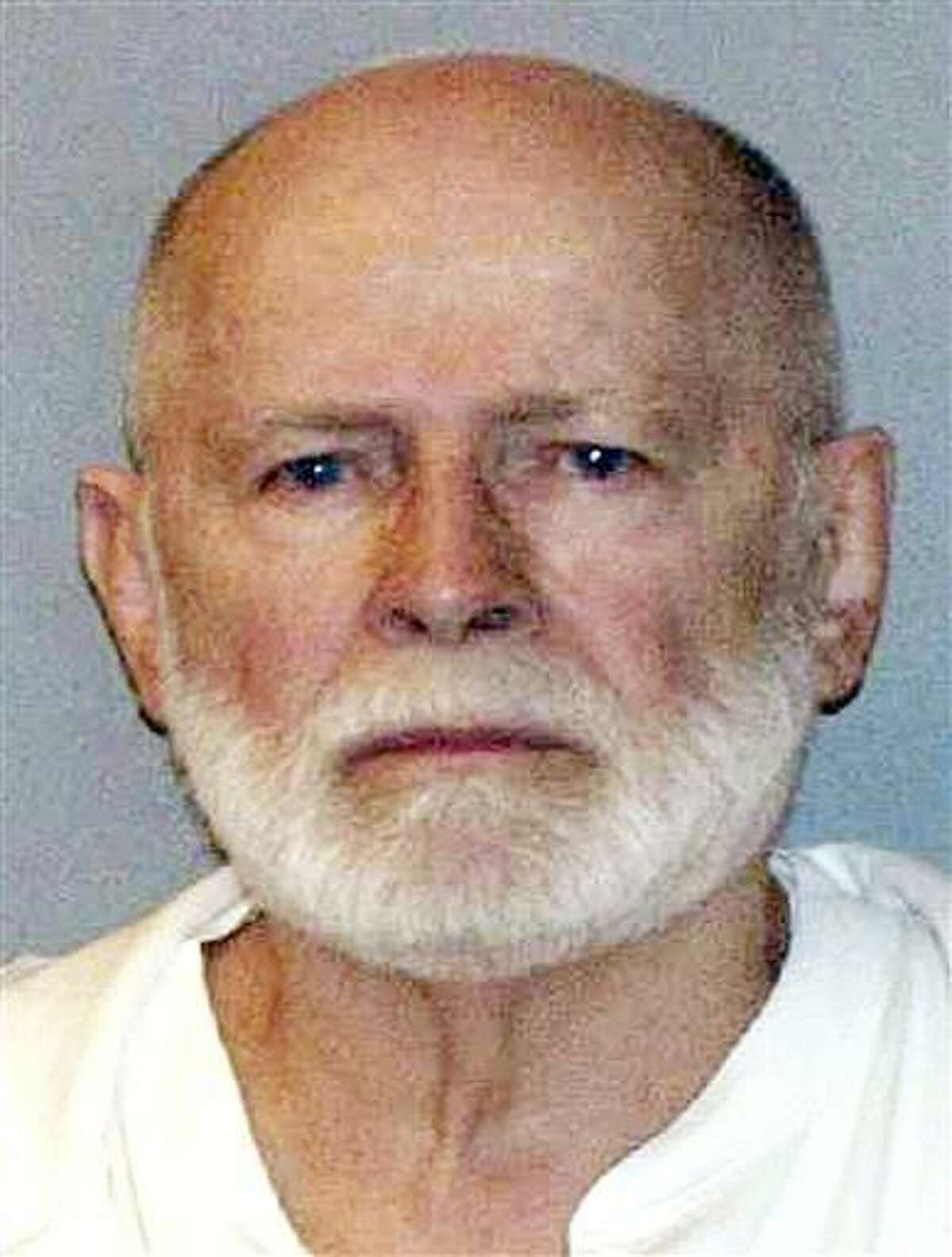 This file June 23, 2011, booking photo provided by the U.S. Marshals Service shows James "Whitey" Bulger. He was convicted in Boston federal court in August 2013 of multiple murders and other crimes. The U.S. Marshals Service will auction items belonging to Bulger and his girlfriend Catherine Greig on Saturday, June 25, 2016. The proceeds will be divided among the families of Bulger's victims. (AP Photo/U.S. Marshals Service)