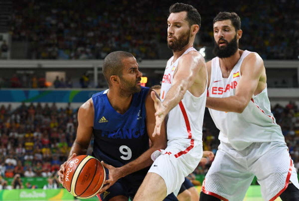 France's point guard Tony Parker (L) is blocked by Spain's small forward Rudy Fernandez during a Men's quarterfinal basketball match between Spain and France at the Carioca Arena 1 in Rio de Janeiro on August 17, 2016 during the Rio 2016 Olympic Games. / AFP PHOTO / Mark RALSTONMARK RALSTON/AFP/Getty Images