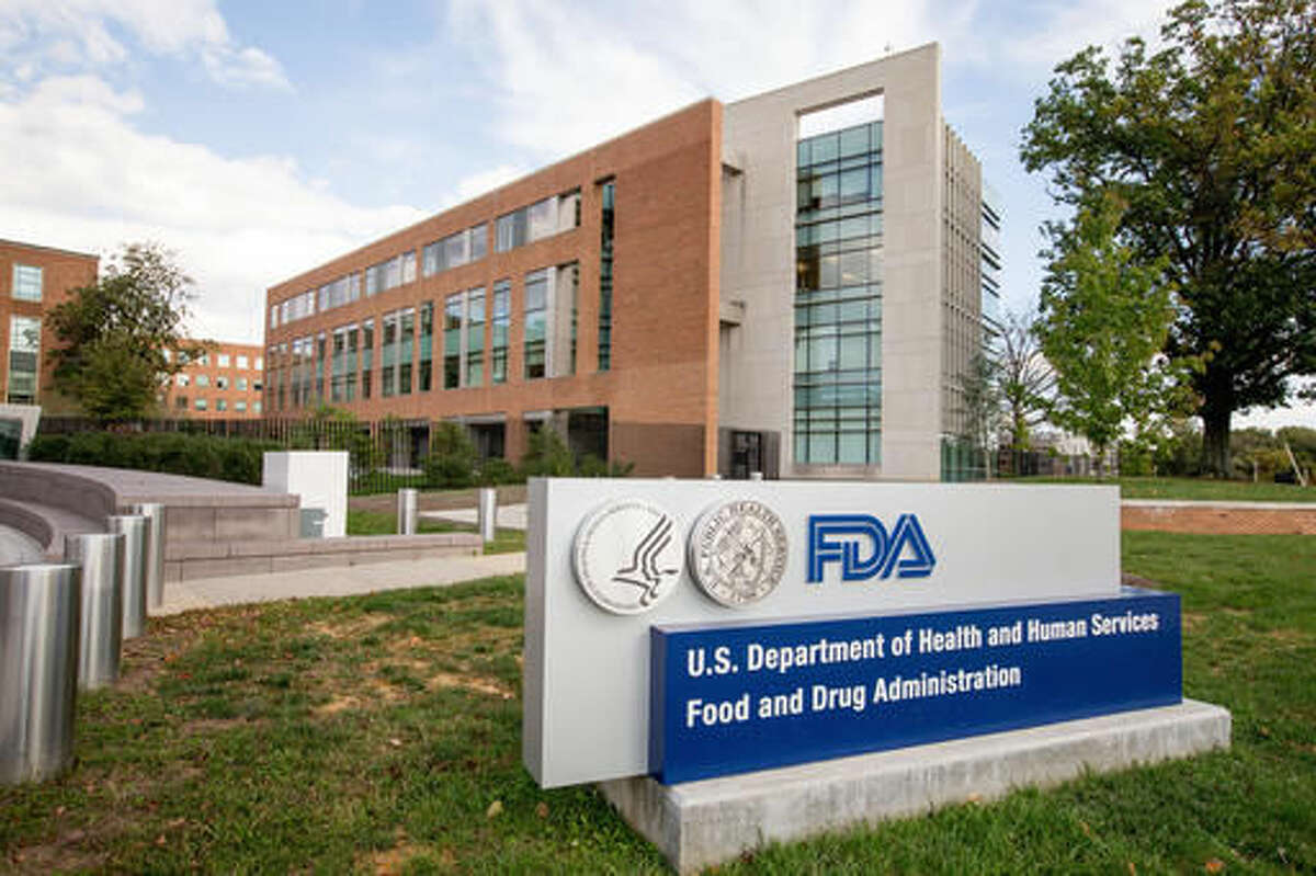 This Oct. 14, 2015, file photo, shows the Food & Drug Administration campus in Silver Spring, Md. The Food and Drug Administration says it will reevaluate its definition of “healthy,” which could upend how a range of foods are marketed. The FDA currently allows use of the term on packaging only when products meet certain nutrient criteria. (AP Photo/Andrew Harnik)