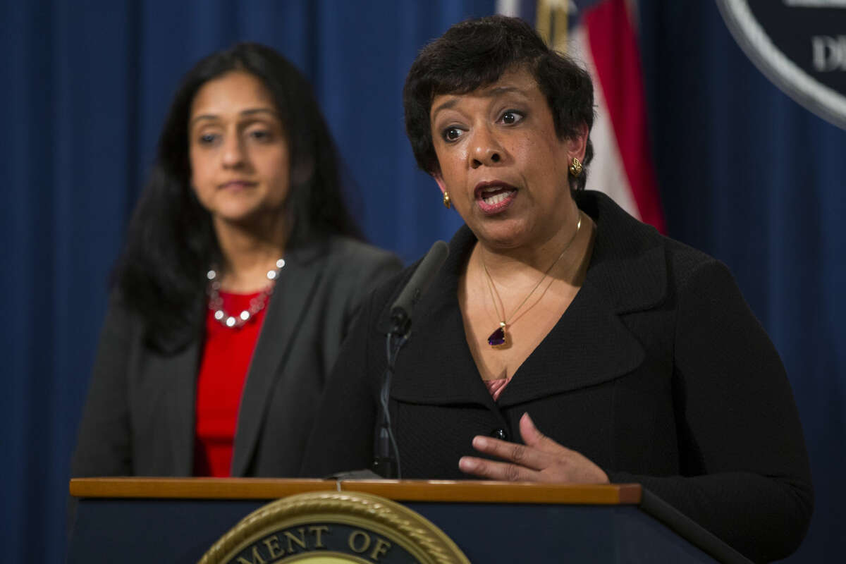Vanita Gupta, head of the Justice Department's civil rights division listens at left as Attorney General Loretta Lynch speaks during a news conference at the Justice Department in Washington, Monday, May 9, 2016. North Carolina Gov. Pat McCrory's administration sued the federal government Monday in a fight for a state law that limits protections for lesbian, gay, bisexual and transgender people. (AP Photo/Evan Vucci)