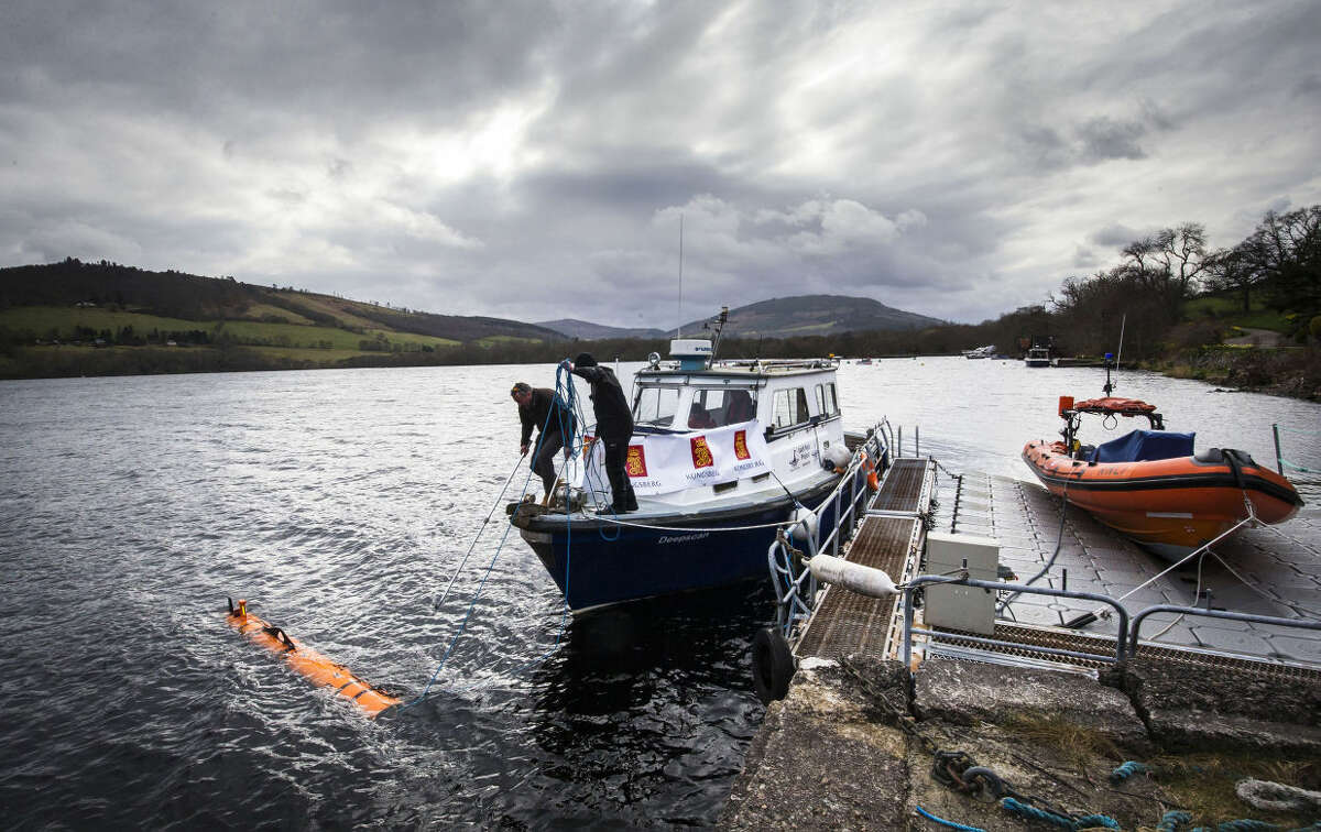 In this picture taken April 13, 2016, engineer John Haig helps launch the Munin AUV (Autonomous Underwater Vehicle) at Loch Ness. An underwater robot exploring Loch Ness has discovered a dark, monster-shaped mass in its depths. Disappointingly, tourism officials say the 30-foot (9 meter), object is not the fabled Loch Ness Monster, but a prop left over from a 1970 film. (Danny Lawson/PA via AP) UNITED KINGDOM OUT NO SALES NO ARCHIVE