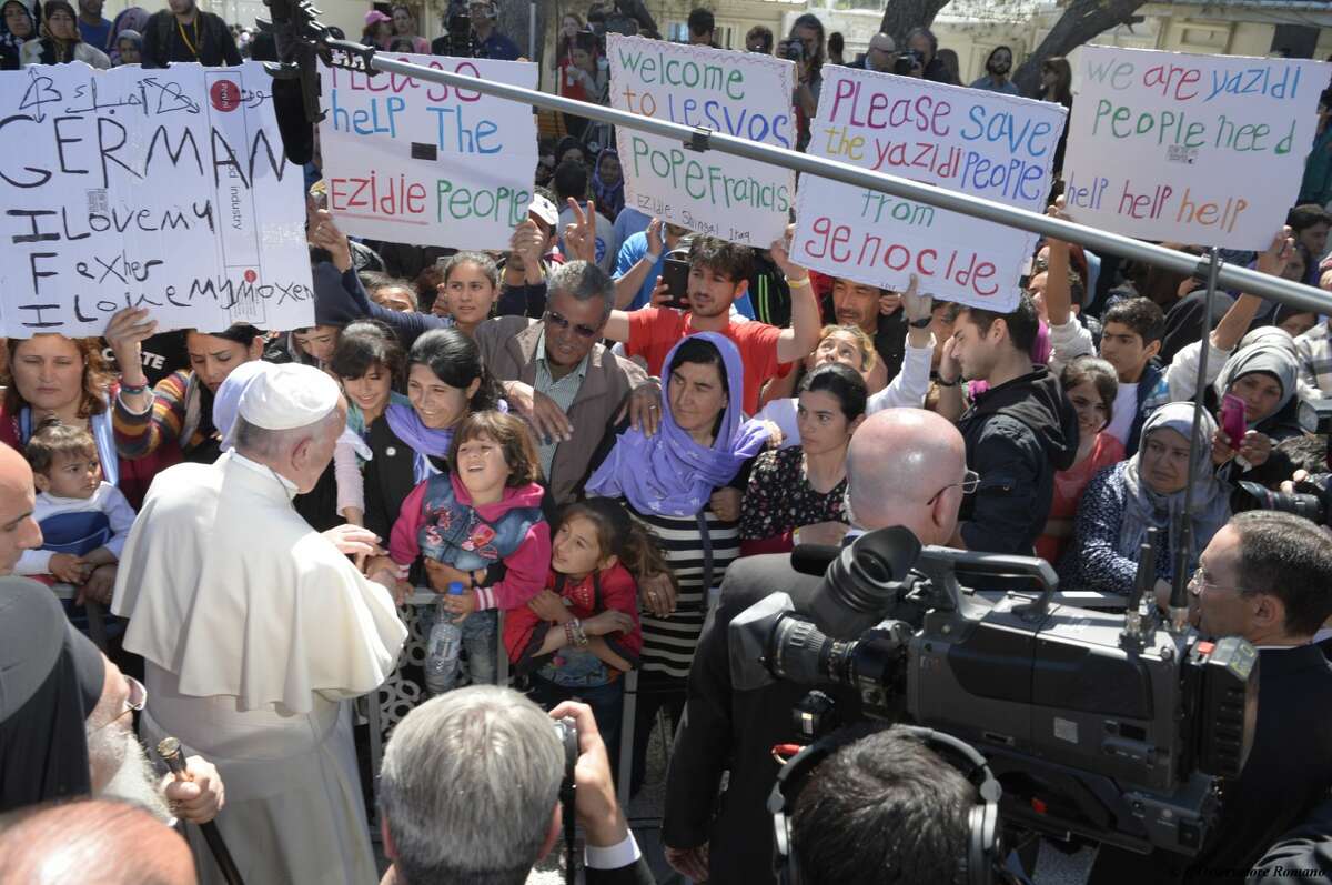Pope Francis visits the Moria refugee camp in the Greek island of Lesbos, Saturday April 16, 2016. Pope Francis travelled Saturday to Greece for a brief but provocative visit to meet with refugees at a detention center as the European Union implements a controversial plan to deport them back to Turkey. (Osservatore Romano/Pool photo via AP)