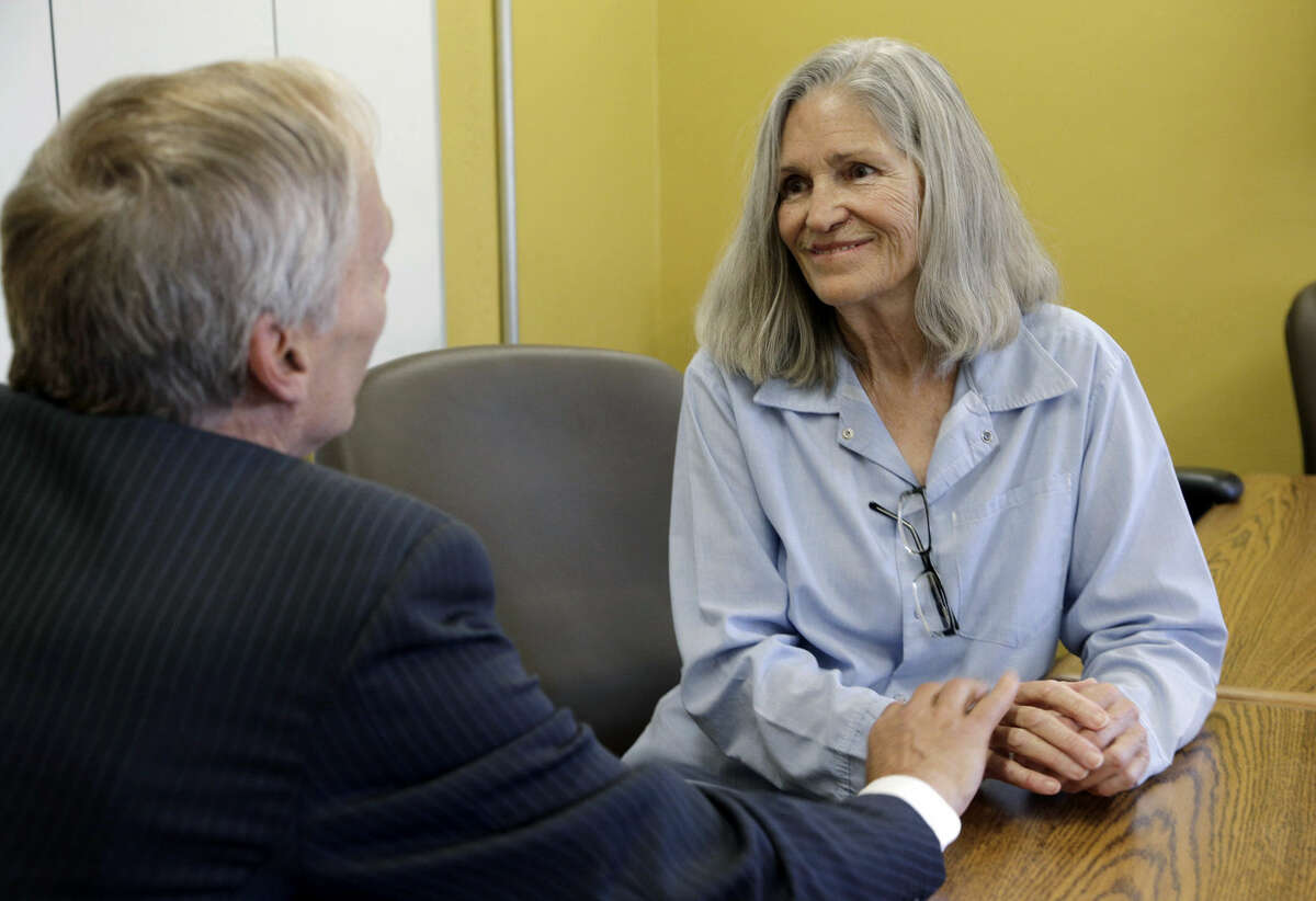 Former Charles Manson follower Leslie Van Houten confers with her attorney Rich Pfeiffer during a break from her hearing before the California Board of Parole Hearings at the California Institution for Women in Chino, Calif., Thursday, April 14, 2016. A California panel recommended parole Thursday for former Charles Manson follower Leslie Van Houten more than four decades after she and other cult members went to prison for the notorious killings of a wealthy grocer and his wife. (AP Photo/Nick Ut)