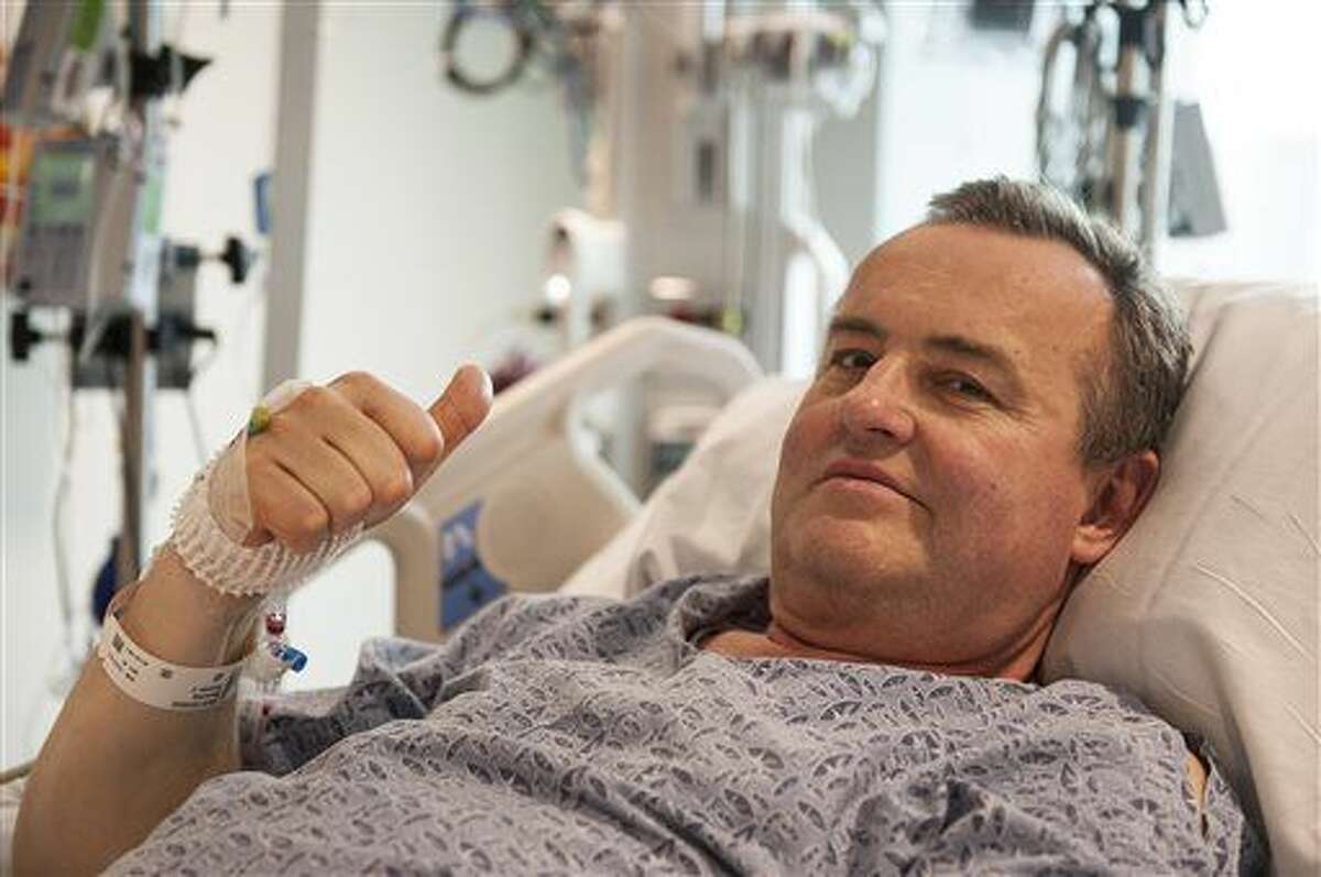In this May 13, 2016 photo provided by Massachusetts General Hospital, Thomas Manning gives a thumbs up after being asked how he was feeling following the first penis transplant in the United States, in Boston. The organ was transplanted from a deceased donor. (Sam Riley/Mass General Hospital via AP)