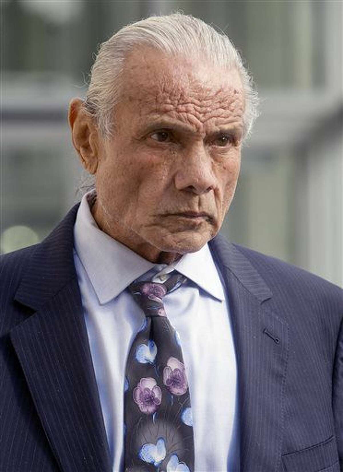 FILE - In this Nov. 2, 2015, file photo, former professional wrestler Jimmy "Superfly" Snuka leaves after his formal arraignment at the Lehigh County Courthouse in Allentown, Pa. A prosecution expert is scheduled to testify Wednesday, May 18, 2016, on the second day of a competency hearing for Snuka, who is charged in the death of his girlfriend in Pennsylvania more than three decades ago. Snuka, who turns 73 on Wednesday, is fighting to avoid trial on murder and involuntary manslaughter charges. He’s accused in the death of Nancy Argentino, (Michael Kubel/The Morning Call via AP, File) THE EXPRESS-TIMES OUT; WFMZ OUT; MANDATORY CREDIT