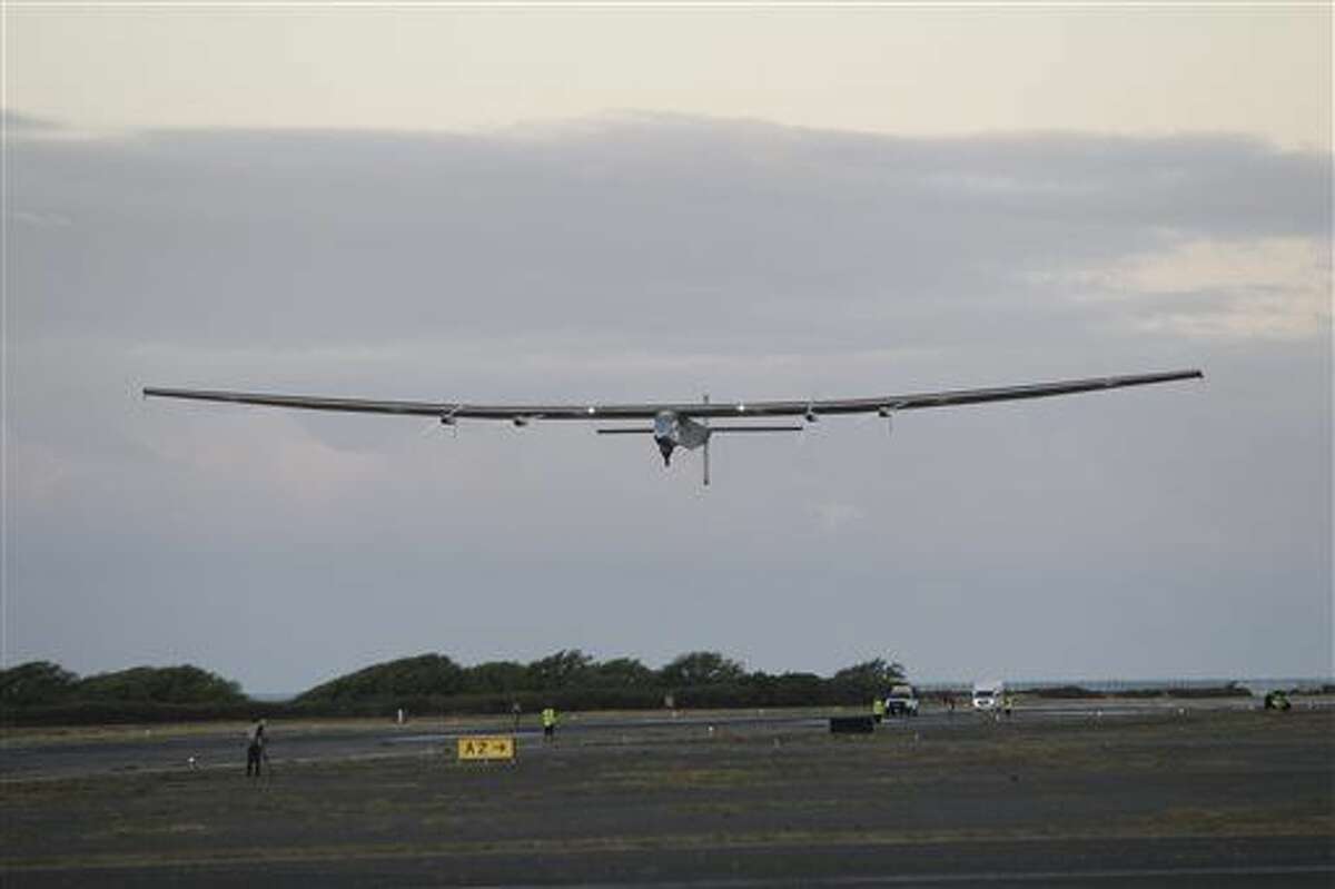 FILE - In this Thursday, April 21, 2016 file photo, the Solar Impulse 2 solar plane lifts off at the Kalaeloa Airport, in Kapolei, Hawaii. The solar plane on an around-the-world journey has reached the point of no return over the Pacific Ocean after departing Hawaii, and now it's California or bust. The plane was cruising over the cold northern Pacific late Thursday at about 20,000 feet with a nearly-full battery as night descended, according to the website that's documenting the journey of Solar Impulse 2. (AP Photo/Marco Garcia, File)