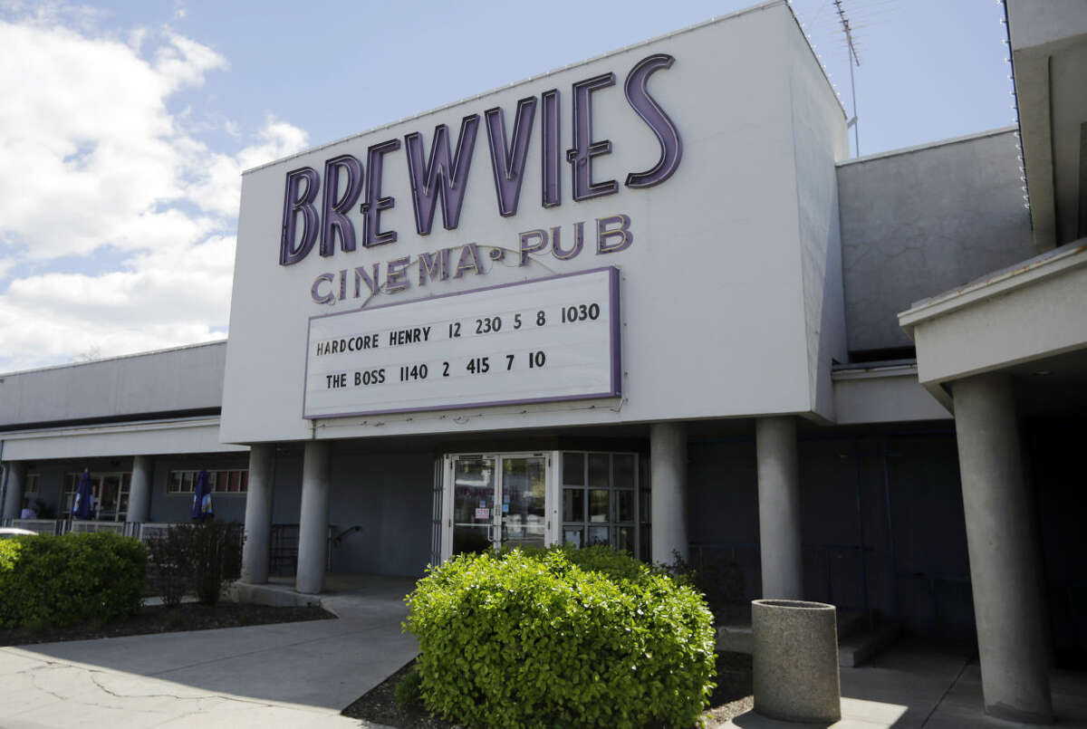FILE - In this Monday, April 18, 2016, file photo, the Brewvies Cinema Pub is viewed in Salt Lake City. Actor Ryan Reynolds is backing the movie theater which is in hot water with Utah liquor authorities for serving drinks during a screening of his movie "Deadpool." The star tweeted about the situation on Sunday, April 24, 2016, writing "Thank god, they've found a way to legislate fun." He also donated $5,000 to a fundraising website set up to help the theater pay its legal bills. (AP Photo/Rick Bowmer, File)