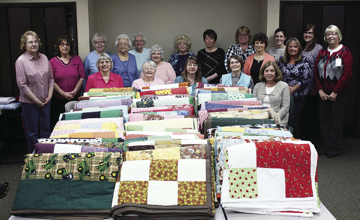 UHS Director Shelli Greschaw and staff pose with Brenda Miller and the Charlie’s Angels Quilting Group that recently donated homemade quilts to the hospice program. The quilts are given to patients who receive care through hospice home care or at the Hospice Residence.