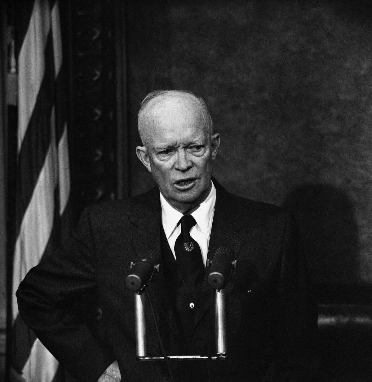 FILE - In this Dec. 10, 1958 file photo, President Dwight Eisenhower speaks during a news conference in Washington. A gay rights group sued the Justice Department on Wednesday, April 27, 2017, for failing to produce hundreds of pages of documents related to a 1953 order signed by President Dwight Eisenhower that empowered federal agencies to investigate and fire employees thought to be gay. (AP Photo/Bill Allen, File)