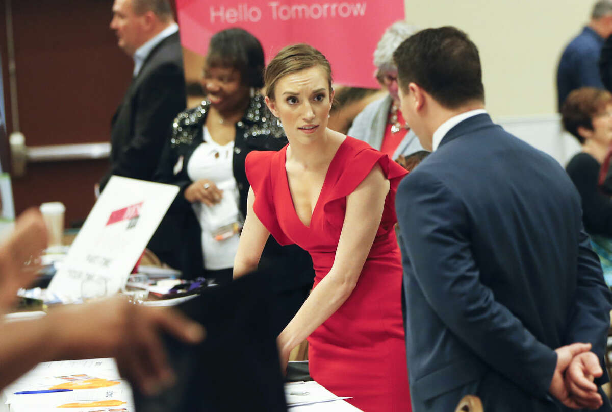 In this Wednesday, March 30, 2016, photo, job recruiters work their booths at a job fair in Pittsburgh. On Thursday, April 28, 2016, the Labor Department reports on the number of people who applied for unemployment benefits in the previous week. (AP Photo/Keith Srakocic)