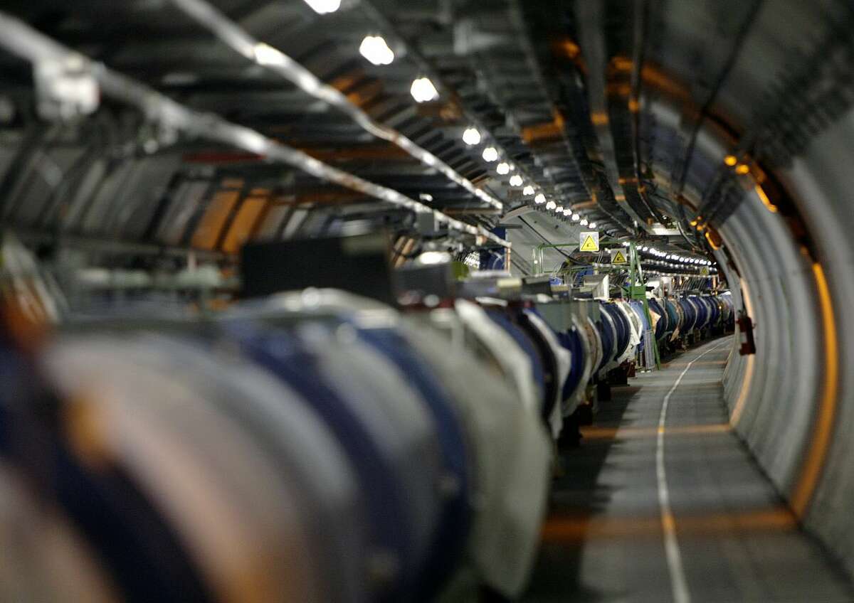 FILE - A May 31, 2007 file photo shows a view of the Large Hadron Collider in its tunnel at the European Particle Physics Laboratory, CERN, near Geneva, Switzerland. It's one of the physics world's most complex machines, and it has been immobilized — temporarily — by a weasel. Spokesman Arnaud Marsollier says the world's largest atom smasher, the LHC, at CERN, has suspended operations because a weasel invaded a transformer that helps power the machine and set off an electrical outage on Thursday night, April 28, 2016. (Martial Trezzini/Keystone via AP, File)