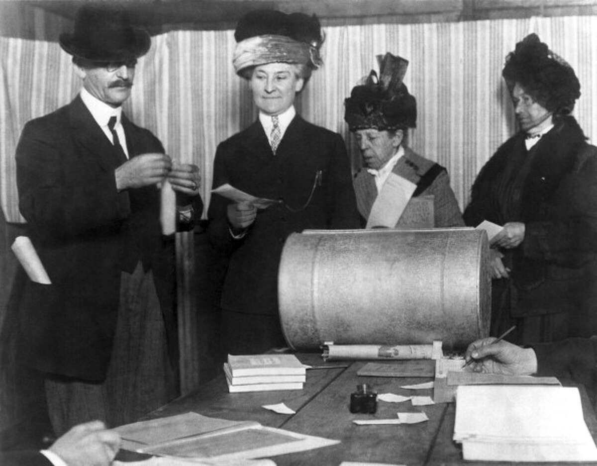 Three unidentified women make history by becoming the first of their sex to vote in an election after the 19th Amendment was passed, San Francisco, California, late 1910s or early 1920s. (Photo by Underwood Archives/Getty Images)